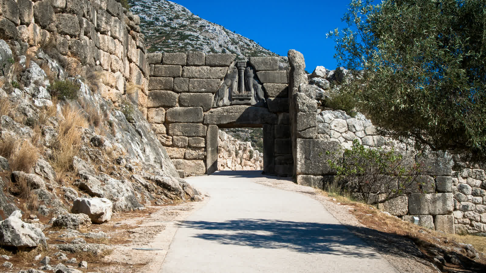 The walled ramp climbing to the Lion Gate at Mycenae