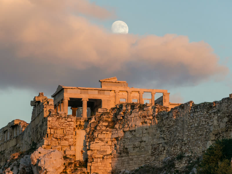 The Erechtheion on the Acropolis of Athens in evening light, the moon above it