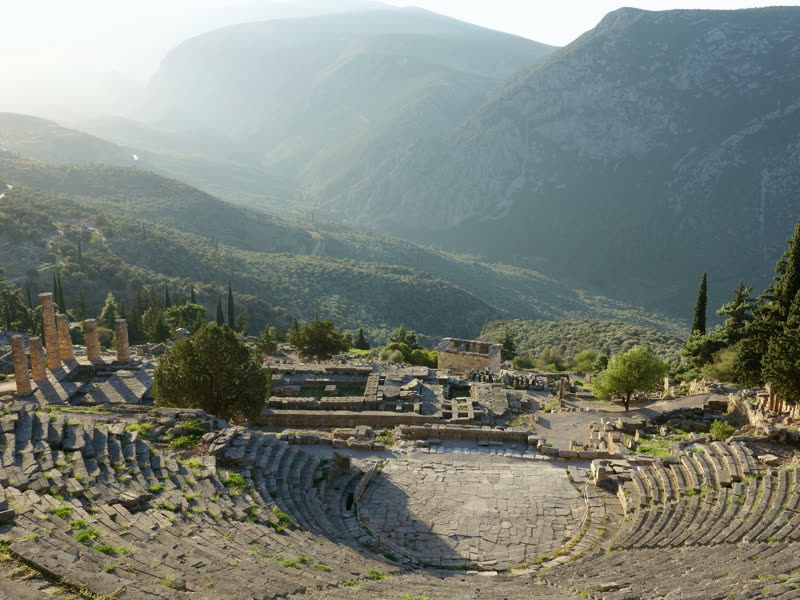 The theatre of Delphi above the sanctuary, the valley of the Pleistos beyond